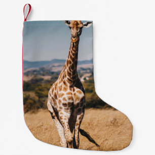 MEIA DE NATAL PEQUENA GIRAFFE RODADA POR GRAMA MARCADA