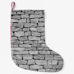 Meia De Natal Pequena Muro de pedra cinza como fundo abstrato.