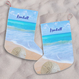 Meia De Natal Pequena Natal na Praia do Dólar de Areia do Oceano Tropica
