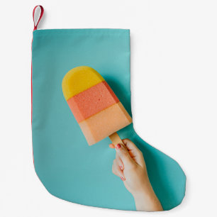 Meia De Natal Pequena Pessoa que segura picolé amarelo e rosa