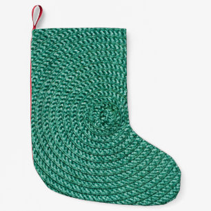 Meia De Natal Pequena Textura artificial de tecido verde trançada.