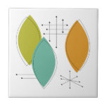 Meio século de Formas de Surfboard Verde Laranja<br><div class="desc">Este azulejo cerâmico moderno,  com forma turquesa,  verde e laranja,  e starbursts pretos,  irá adicionar um breque de cor ao seu projeto de unção ou como uma peça de sotaque.</div>