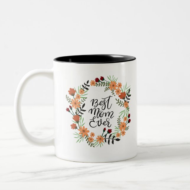 Melhor mãe de sempre com uma caneca de café com to (Esquerda)