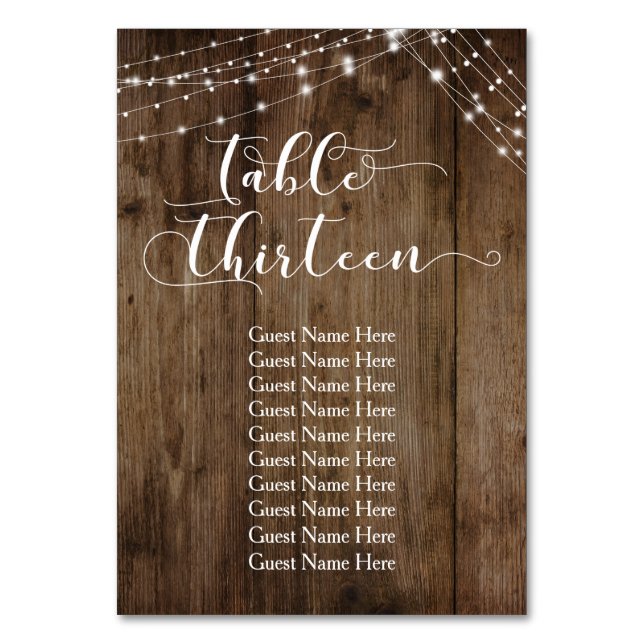 Mesa de madeira e luzes treze com cartão de nomes  (Frente)