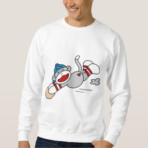 Monkey o mergulho do basebol no camiseta e em