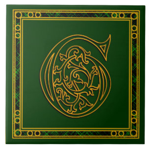 Monograma "ouro irlandês de G" em azulejos verdes