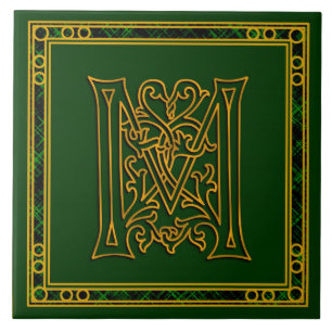 Monograma "ouro irlandês de M" em azulejos verdes