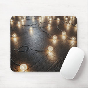 Mousepad Corda-luz brilhante num pavimento de madeira