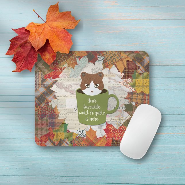 Mousepad Fall Break Cat (A Fall Break Cat Mouse Pad on the table.)