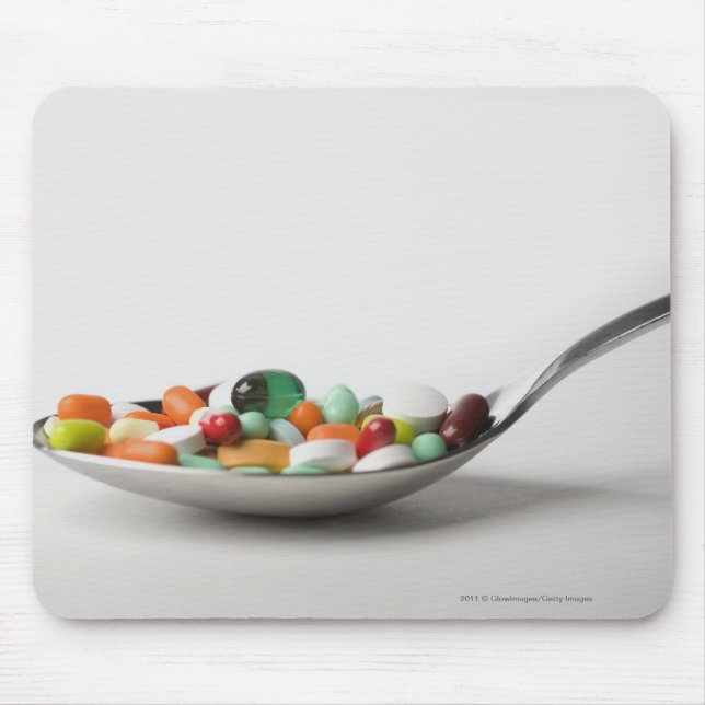 Mousepad Fim-acima dos comprimidos em uma colher (Frente)