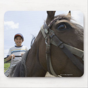 Mousepad Menino que monta um cavalo