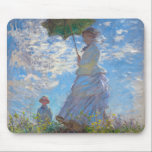 Mousepad Mulher com Parasol, Monet<br><div class="desc">Oscar-Claude Monet (14 de novembro de 1840 - 5 de dezembro de 1926) era um pintor francês, fundador da pintura impressionista francesa e o mais consistente e prolífico praticante da filosofia do movimento de expressar suas percepções diante da natureza, especialmente quando aplicada à pintura plein air horizontal. O termo "impressionismo"...</div>