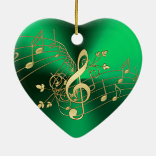 Notas da música e enfeites de natal verdes do Clef