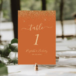 Numeração De Mesa Casamento de Borda Dourada com Largura Laranja Que<br><div class="desc">A borda superior deste elegante número moderno da mesa de casamento apresenta um design dourado faux glitter. O texto personalizável combina manuscrito pálido de cor dourada,  fontes copperplate e itálico em um fundo laranja queimado.</div>