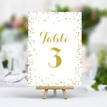 Numeração De Mesa Faux Dourado Folha de Folhas de Folha Elegante Con<br><div class="desc">Adicione um pouco de brilho e sofisticação à sua recepção de casamento com estes números elegantes de mesa. Apresentando uma delicada dispersão de pontos falsos de configuração de brilho dourado em um fundo branco nítido, essas placas criam um aspecto moderno e chique. Personalize facilmente com os números das tabelas para...</div>