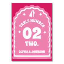 Foto dos Casais cor-de-rosa e magenta com arco ond