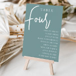 Numeração De Mesa Mesa com script manual quatro   nomes de convidado<br><div class="desc">Cartões simples e chic de mesa, em cor poeirenta e branco, fazem uma declaração elegante no seu casamento ou evento. Design apresenta "mesa [number]" em uma combinação de olhares de serif clássica e de caracteres de script manuscritos, com nomes individuais de convidados por baixo. Design repete-se de ambos os lados....</div>