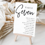 Numeração De Mesa Mesa com script manual SEVEN   Nomes de convidado<br><div class="desc">Cartões simples e chic em preto e branco clássico fazem uma declaração elegante no seu casamento ou evento. Design apresenta "mesa [number]" em uma combinação de olhares de serif clássica e de caracteres de script manuscritos, com nomes individuais de convidados por baixo. Design repete-se de ambos os lados. Cartões numerados...</div>
