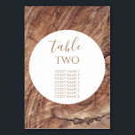 Numeração De Mesa Nomes de Convidados Rustic Wood Weding<br><div class="desc">Este design apresenta um fundo de madeira rústico. O simples fundo de madeira marrom é complementado pelo texto branco e pelo moderno elemento do círculo central limpo que rodeia o título. Os tons castanhos dos grãos de madeira criam uma sensação rústica de jardim florestal rural. Elegante número da mesa de...</div>