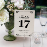 Numeração De Mesa Nomes de Quadro Branco Preto Elegante e Data de Ca<br><div class="desc">Placas de mesa elegantes em preto-e-branco com fontes em negrito e um detalhe de quadro de ornamentado em cima e em baixo. Cartões de números de mesas preto e branco personalizados com seus nomes e data de casamento em um elegante design preto e branco.</div>