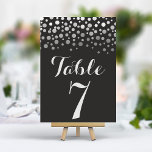 Numeração De Mesa Número da Tabela Preta Elegante de Confetti Silver<br><div class="desc">Adicione um toque de glamour e brilho à sua recepção de casamento com estes números elegantes de mesa. Apresentando um fundo negro ousado com uma cascata de cisne de um confete prateado, estas cartas criam um aspecto moderno e chique. Personalize facilmente com os números das tabelas para uma configuração de...</div>