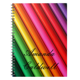 O arco-íris colorido escreve o caderno