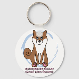 O cão triste Eyes o chaveiro de Shiba Inu