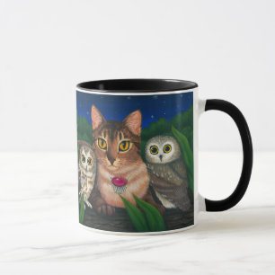 O gato Abyssinian viu para whet a caneca da arte
