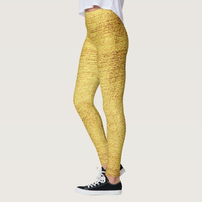 O mundo ouro das leggings modernas e brilhantes (Esquerda)