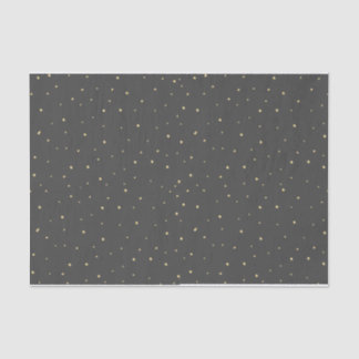 O ouro pontilha o preto do lenço de papel