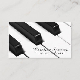 O piano preto & branco fecha o cartão de professor