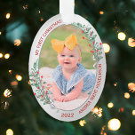 Ornamento Classic Newborn 1st Christmas Plants Silver Frame<br><div class="desc">The ornament in oval shape has a classic silver frame adorned with Christmas plants and ribbon to display your own special memory of your new baby. The bright and shiny silver border encircles your photos. The holly, greenery and silk ribbon complete the whole design with a joyful atmosphere of the...</div>