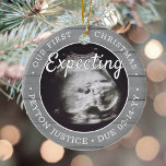Ornamento De Cerâmica 2 Photo Baby Ultrasound New Parents Faux Gray Wood<br><div class="desc">Celebrate the precious gift of your newest family member with a stylish two photo round ceramic ornament. Gender neutral design is suitable for a new baby boy or girl. Wording and pictures on this template are simple to personalize, and can be different or the same on front and back. (IMAGE...</div>