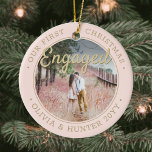 Ornamento De Cerâmica 2 Photo Our First Christmas Engaged Blush and Gold<br><div class="desc">Celebrate the joyful 1st holiday of your engagement with a custom 2 photo "Our First Christmas Engaged" round ceramic ornament. All text and images on this template are simple to personalize and can be different or the same on front and back. (IMAGE & TEXT DESIGN TIPS: 1) To adjust position...</div>