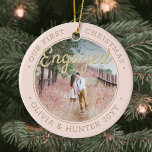 Ornamento De Cerâmica 2 Photo Our First Christmas Engaged Blush and Gold<br><div class="desc">Celebrate the joyful 1st holiday of your engagement with a custom 2 photo "Our First Christmas Engaged" round ceramic ornament. All text and images on this template are simple to personalize and can be different or the same on front and back. (IMAGE & TEXT DESIGN TIPS: 1) To adjust position...</div>