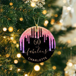 Ornamento De Cerâmica 60 Fabuloso aniversário do cintilador preto do arc<br><div class="desc">Trendy e glamourosa para o 60º aniversário. Um fundo preto clássico, decorado com pingos de brilho falso e colorido do arco-íris, pingando tinta, parece roxo, rosa e ouro rosa. Com o texto: 60 e fabuloso. Personalize e adicione um nome e uma idade. Texto colorido do ouro. A palavra Fabuloso é...</div>