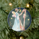 Ornamento De Cerâmica Angelic Winter Music Playing Angel<br><div class="desc">Traga um belo toque de elegância angélica com este lindo anjo tocando harpa. Neves em queda com estrelas brilhantes são apresentadas em segundo plano. Passe na minha loja para outros designs especiais.Obrigados</div>
