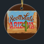 Ornamento De Cerâmica Arizona Scottsdale Viagens vintage do Deserto<br><div class="desc">Scottsdale Arizona neo viagens vintage na design de de desenho em engraçadinho estilo retrô com deserto,  cacto e rochas. Azul,  marrom e vermelho com cacto verde.</div>