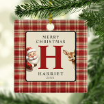 Ornamento De Cerâmica Árvore de Fotografias de Papais noeis de Natal Mon<br><div class="desc">Invista em mais do que apenas decorar esta estação festiva com os nossos adoráveis ornamentos de monograma em árvore. Projetados com uma mistura nostálgica de xadrezes, Papais noeis e suas pequenas renas, eles enquadram elementos pessoais como o nome de seu filho e a foto da família. Feitos para enriquecer suas...</div>