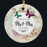 Ornamento De Cerâmica Borboletas em Shabby Vintage Collage Sr. e Sra.<br><div class="desc">Um ornamento de casamento projetado com borboletas em magenta rosa e verde esmeralda. Um quadro circular branco com os detalhes do seu casamento em camadas sobre uma colagem vintage shabby com rosas rosa e outros elementos decorativos. O Sr. e a Sra. escreveram em uma letra de roteiro de tendências de...</div>
