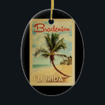 Ornamento De Cerâmica Bradenton Palm Viagens vintage<br><div class="desc">Um impressão de arte moderno do século médio,  Bradenton Florida,  no estilo viagens vintage. Ele apresenta uma palmeira curva na praia arenosa com oceano sob um céu azul nublado.</div>