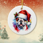 Ornamento De Cerâmica Bulldog no Natal Personalizado do Chapéu<br><div class="desc">Se você ama buldocos e quer Enfeites de natal fofo então aqui vai você! Estilo de aquarela bonito ai art English Bulldog em Santa Hat. Adicione sua saudação de Natal na área de personalização.</div>