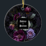 Ornamento De Cerâmica Buquê Floral Roxo Gótico em Lace com Ravens<br><div class="desc">Este ornamento é perfeito para um casamento gótico moderno e elegante. O moody floral design apresenta um buquê natural de flores roxas em um arranjo luxuoso em um fundo roxo escuro e preto com dois corvos. Você pode personalizar com seus primeiros nomes</div>