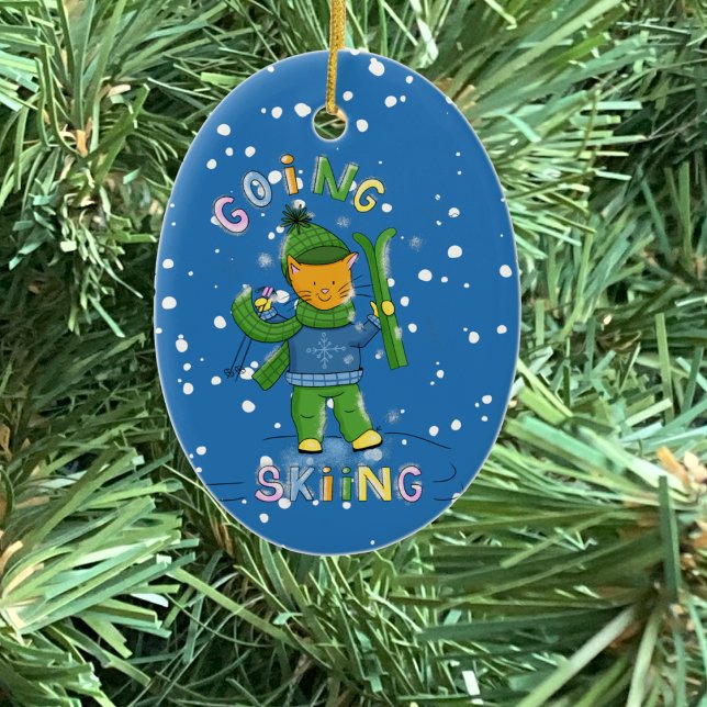 Ornamento De Cerâmica Cat going skiing Christmas ornament (Cat going skiing blue oval ceramic Christmas ornament .)