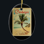Ornamento De Cerâmica Cienfuegos Cuba Palm Tree Viagens vintage<br><div class="desc">Um impressão de arte moderno do século médio único,  Cienfuegos Cuba,  no estilo da poster viagens vintage. Ele apresenta uma palmeira curva na praia arenosa com oceano sob um céu azul nublado.</div>