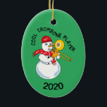 Ornamento De Cerâmica Cool Trombone Player<br><div class="desc">Cool Trombone Player text with a snowman musician playing a horn and wearing a music note scarf is a humorous winter design to tickle the funny bone of low brass musicians and music teachers. 

The date can be changed.</div>