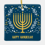 Ornamento De Cerâmica Decorativo Menorah Hanukkah<br><div class="desc">Certifique-se de incluir Hanukkah enquanto celebra o Natal ou adiciona-o à decoração Chanukah. Este ornamento decorativo de Chanucá apresenta uma menorah dourada cercada por folhas, estrelas e espirais contra um rico fundo azul. Adicione a sua própria mensagem no verso ou exclua-a para deixá-la vazio. Excelente para uma família ou amigo...</div>