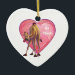 Ornamento De Cerâmica Dia de os namorados de camelo<br><div class="desc">Parada Animal Romântica Camel Love and Hearts Day Gifts and Accessories criados pelo Animal Parade apresenta nossa divertida trabalho de arte de um camelo de corcova giro e marrom segurando um rosa bonito na boca com corações roxos, vermelhos e cor-de-rosa atrás dela pintados pelo nosso talentoso artista Traci Van Wagoner....</div>