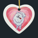 Ornamento De Cerâmica Dia de os namorados Pomerano Branco<br><div class="desc">Parada Animal Cão Branco Romântico Cão Pomerano Personalizado Dons de Coração e Amor, cartas e acessórios trazidos para você pela Imagine isso! Design apresenta nossa trabalho de arte divertida de um cão Pomerano branco segurando um rosa bonito na boca com corações roxos, vermelhos e cor-de-rosa, pintados digitalmente pelo artista infantil,...</div>