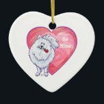 Ornamento De Cerâmica Dia de os namorados Pomerano Branco<br><div class="desc">Parada Animal Cão Branco Romântico Cão Pomerano Personalizado Dons de Coração e Amor, cartas e acessórios trazidos para você pela Imagine isso! Design apresenta nossa trabalho de arte divertida de um cão Pomerano branco segurando um rosa bonito na boca com corações roxos, vermelhos e cor-de-rosa, pintados digitalmente pelo artista infantil,...</div>